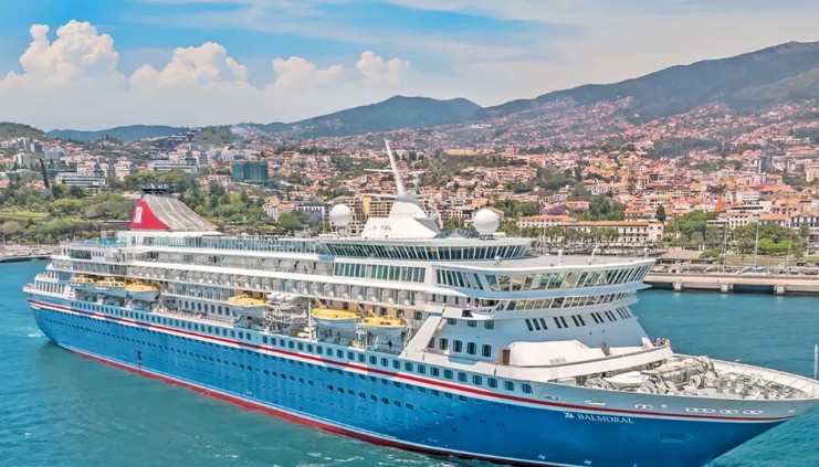 Fred olsen cruise ship on the ocean coming into a port